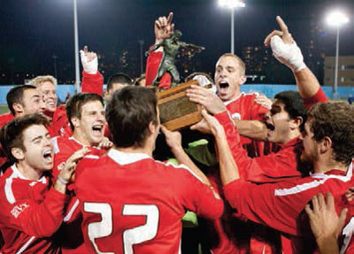 Men's soccer team celebrates a trophy win