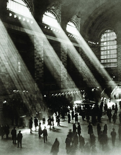 The main concourse, with sun streaming through high windows, in black & white