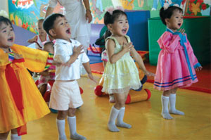Orphans perform a show to attract adoptive parents.