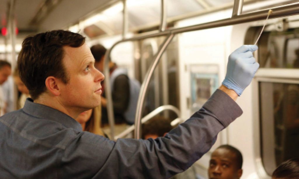 Medical college professor Christopher Mason swabs a New York subway train on Global City Sampling Day.