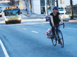 Becky Katz cycles to work on an Atlanta street