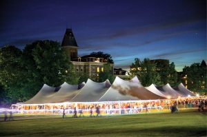 Tents glow at night with Arts Quad parties and partiers.
