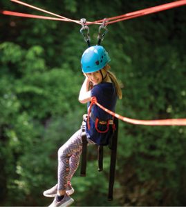 A young child ziplines